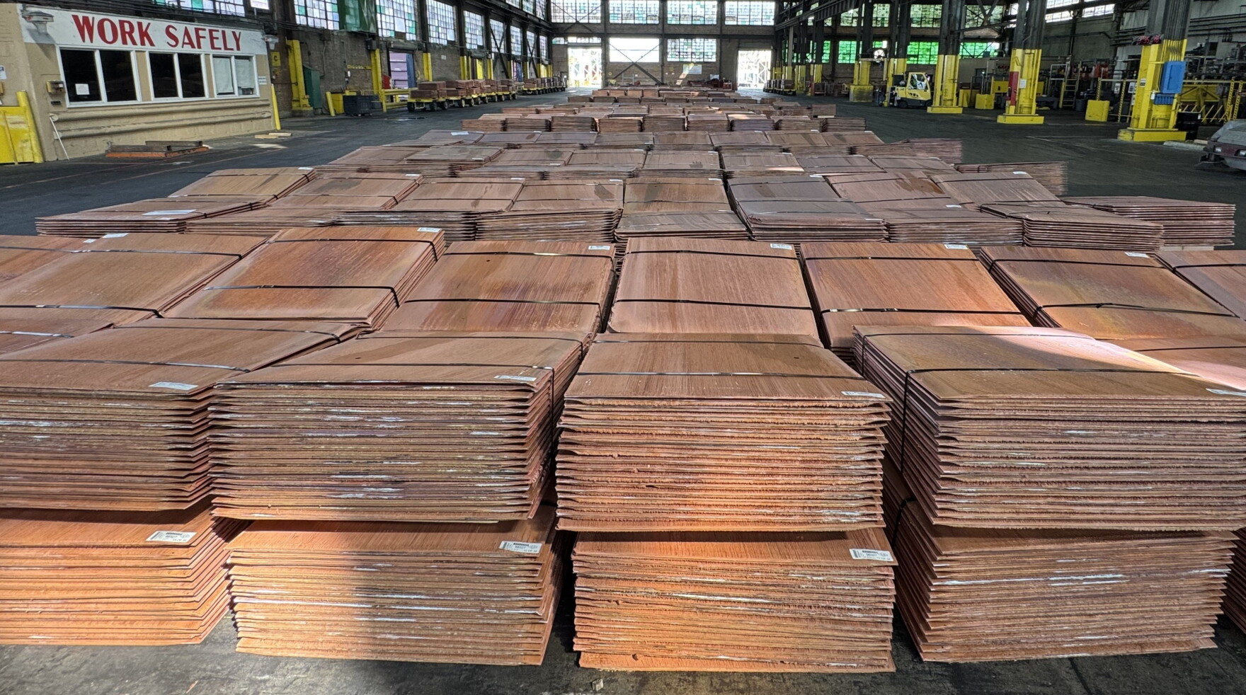 Photograph of copper cathodes stored in a warehouse